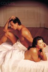 Naked couple in bed having problems
